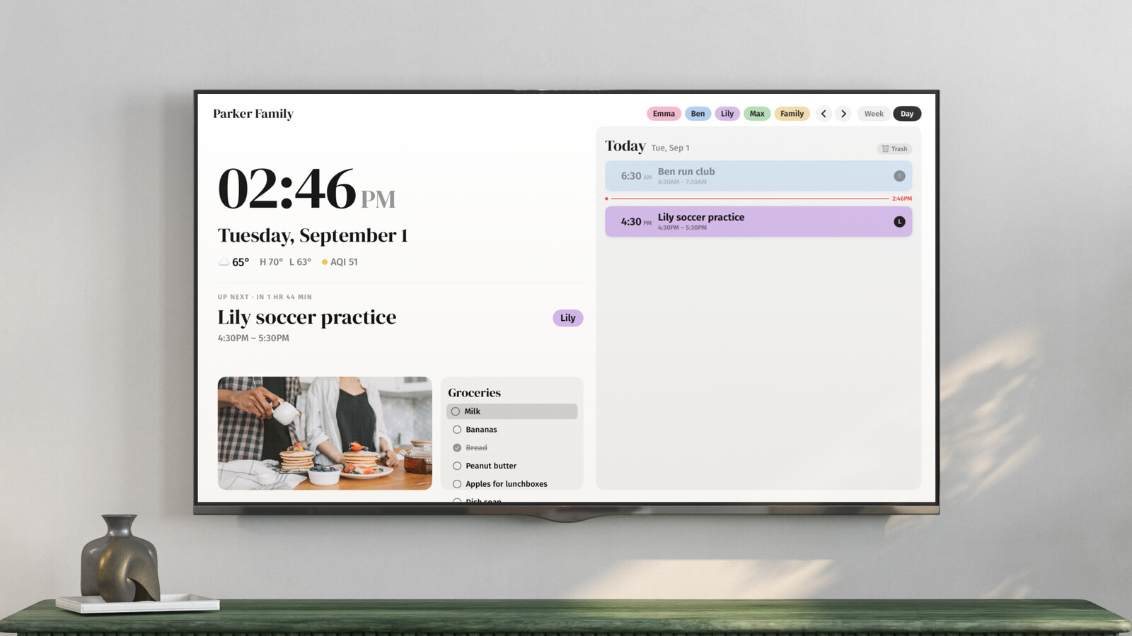 Callie's day view on tvOS: a large clock, the date, the next event, and the family's grocery list